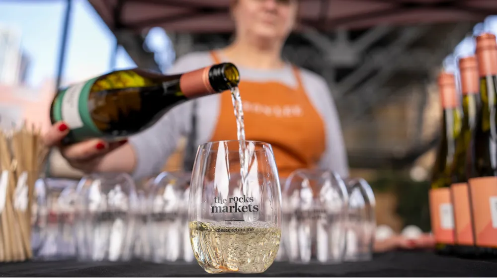 Wine poured into reusable Bettercup stemless cup at The Rocks Market