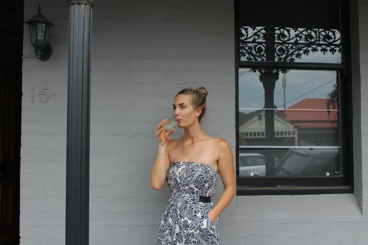 Bettercup co-founder, Christie Kamphuis, sipping from a bettercup reusable champagne flute.